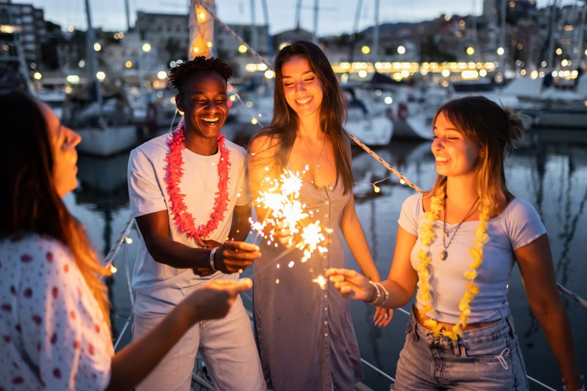 Multiracial friends having fun on boat party in summer vacation